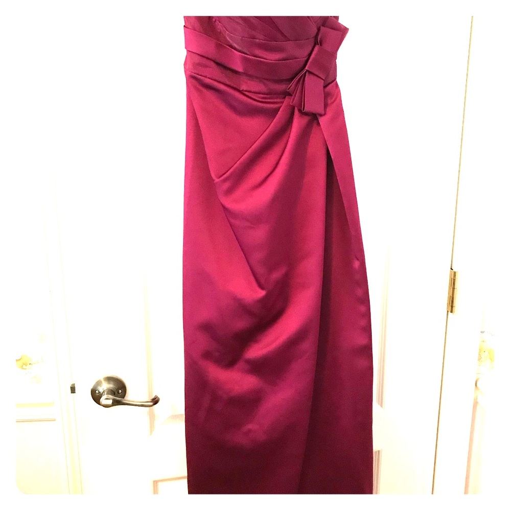 Plum colored, strapless prom/formal gown.